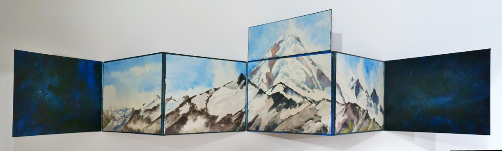 Photo of Suze Woolf accordion fold artist book with watercolors of Mt. Baker